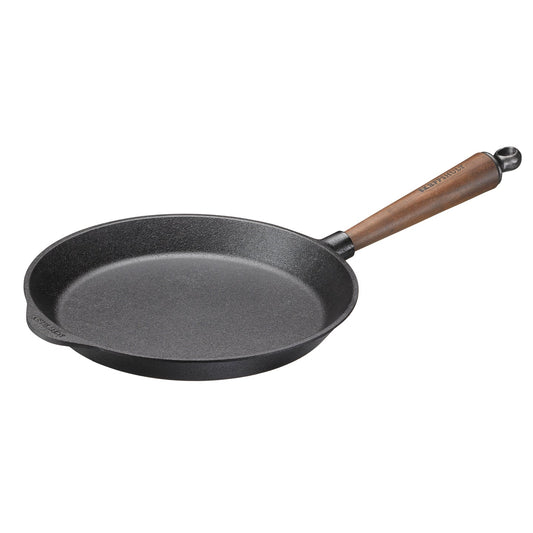 Professional quality cast iron frying pan with walnut handle for exceptional heat retention and cooking performance.